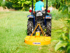Rear view of a compact tractor with the DELEKS BUGGY mower
