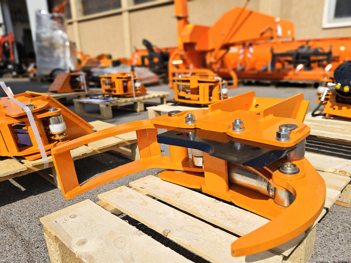 DELEKS CF10 tree shear with grab arms open, warehouse view