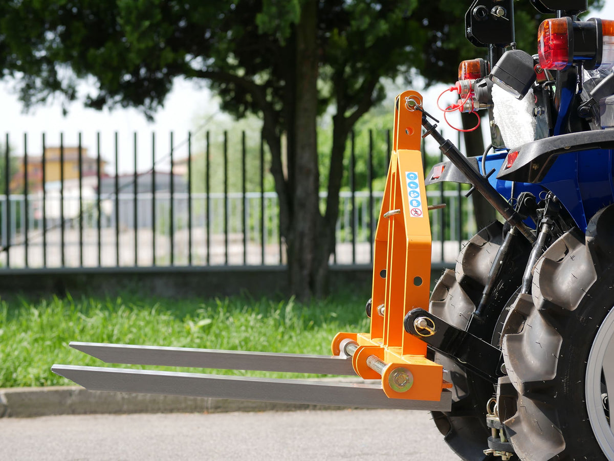 Compact tractor carrying DELEKS D-300 pallet forks