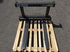 Front view of the DELEKS D-700E pallet forks on a pallet