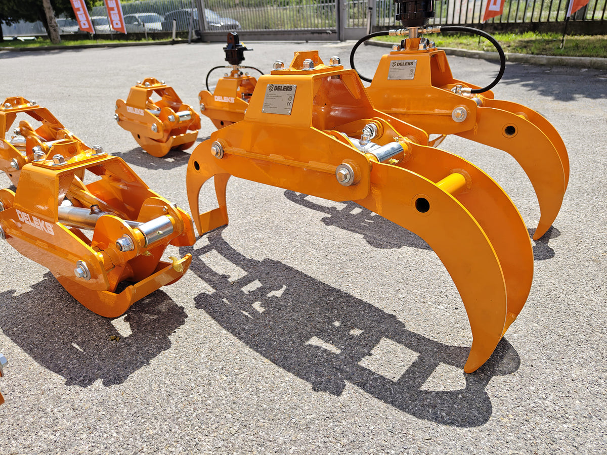 DELEKS DK10H log grapples lined up outside the factory