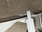 Caliper measuring the plate thickness of the DELEKS DK11 grapple