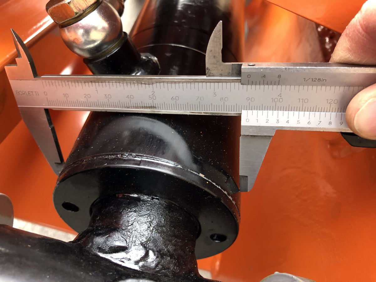 Caliper measuring the pin diameter of the DELEKS DK16 grapple