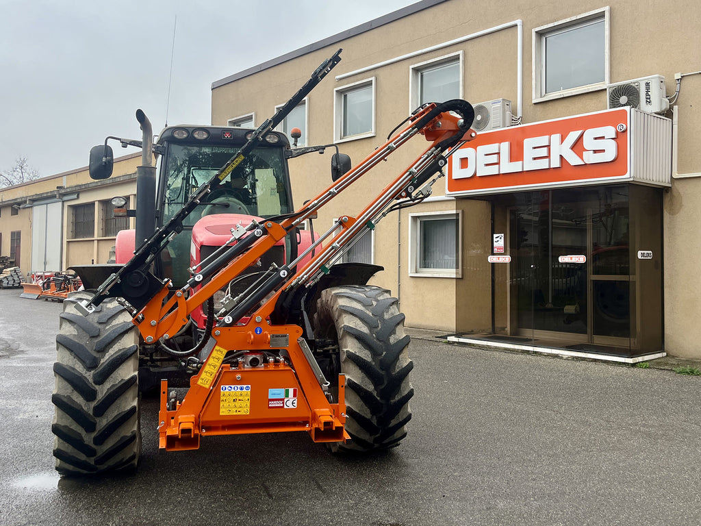 DELEKS FALCO hedge cutter folded on a tractor for transport