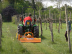 Compact tractor mowing a vineyard with the DELEKS LINCE flail mower