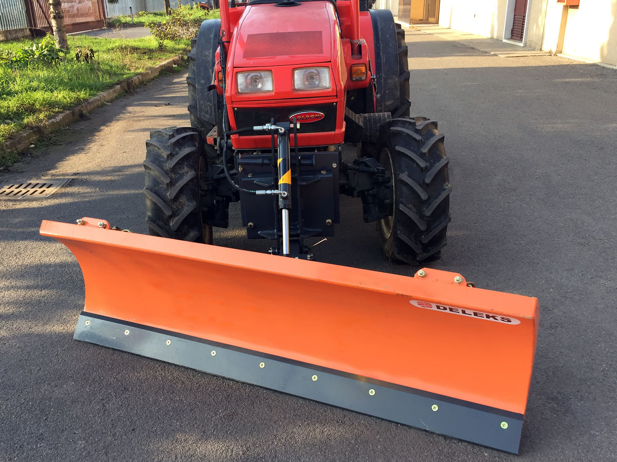 DELEKS LNS snow plow mounted on the front of a compact tractor