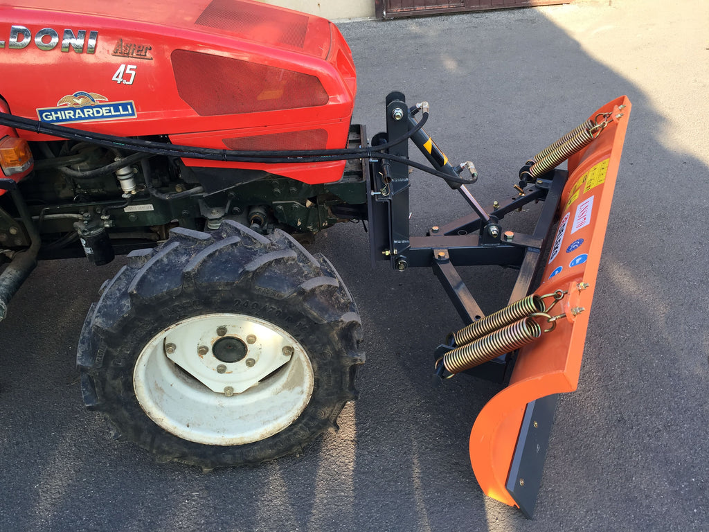 DELEKS LNS snow plow with universal mounting plate on a tractor