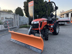 Compact tractor with DELEKS LNS snow plow, front view