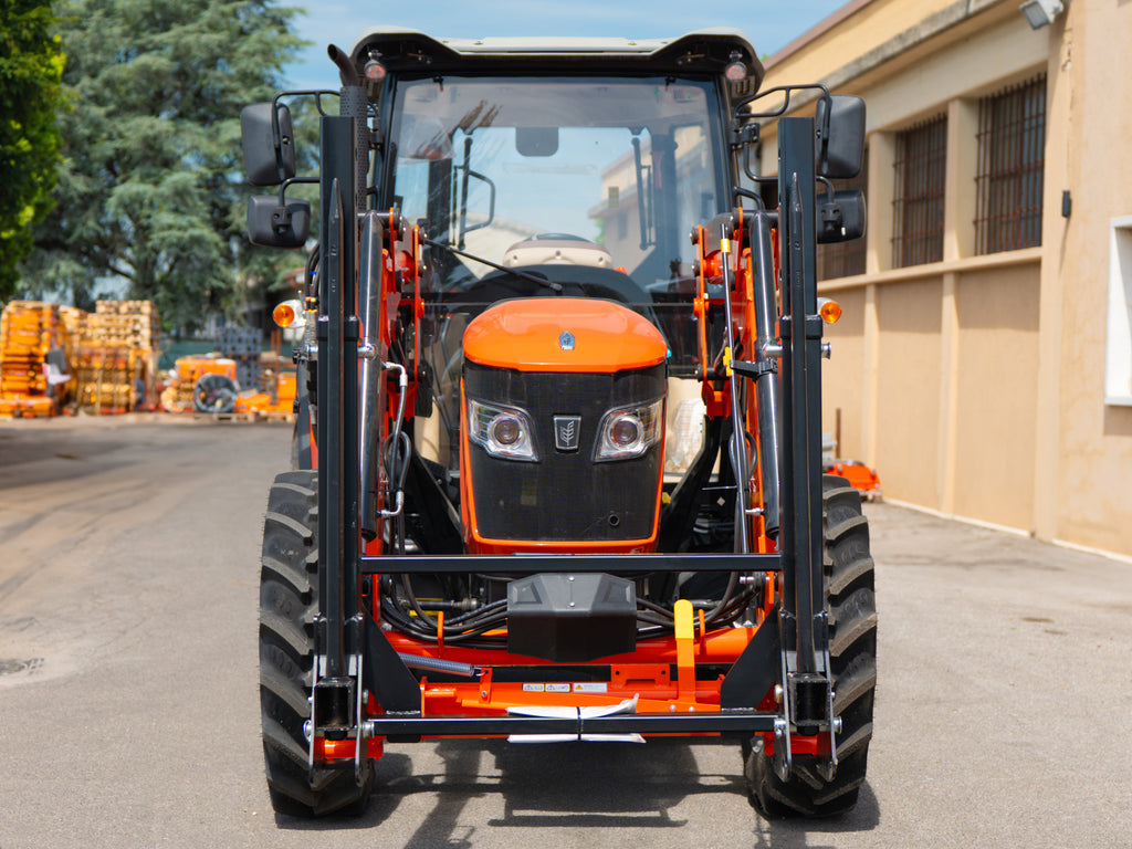 Compact tractor with DELEKS DK1T bale fork, front view