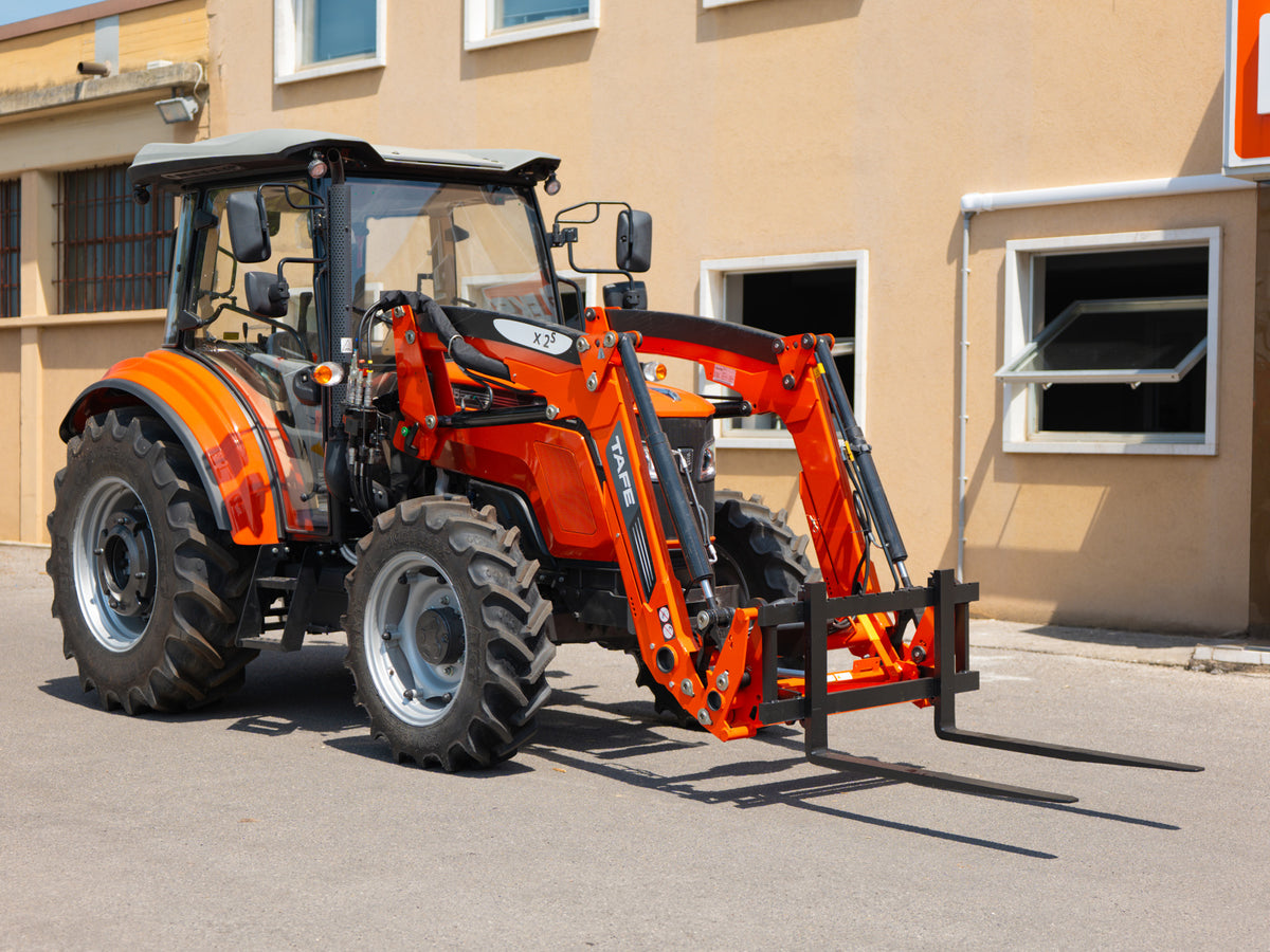 DELEKS pallet forks mounted on a Kubota tractor front loader